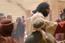 Jesus engaging with a person in a crowd
