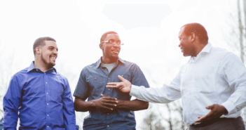 Pastor having a conversation with two young adults