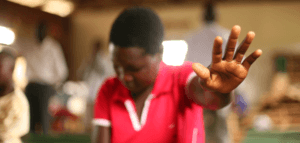 Person worshipping in a small-congregation church