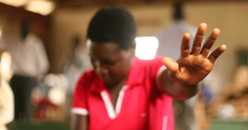 Person worshipping in a small-congregation church