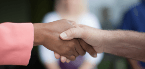 Handshake between two people of different races
