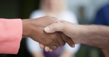 Handshake between two people of different races