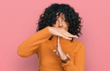 Person making hand signal for time out
