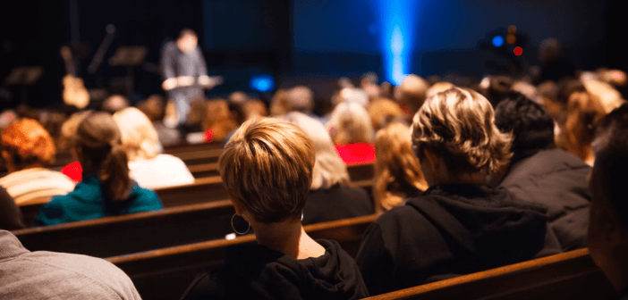 Church pews filled with congregants