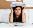 Overwhelmed person at their desk
