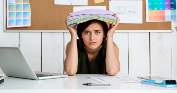 Overwhelmed person at their desk