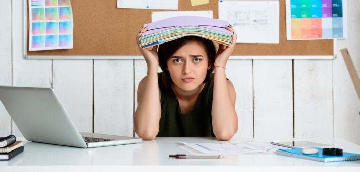 Overwhelmed person at their desk