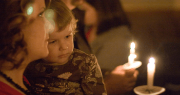 Family at candlelight service