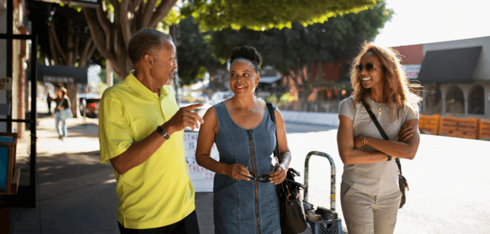 Small group of church folks walking through town