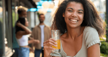 Happy person drinking an agua fresca