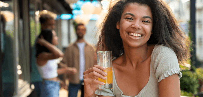 Happy person drinking an agua fresca