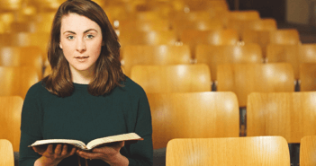 Person sitting alone in church