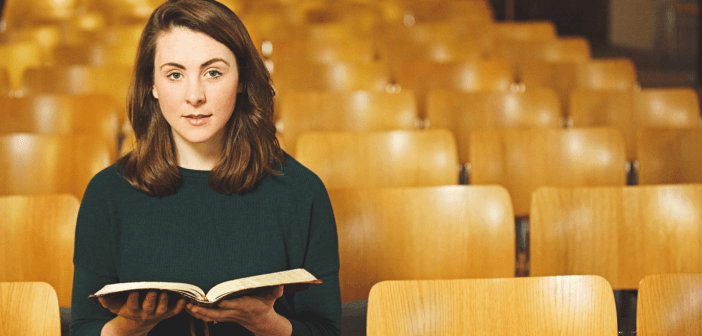 Person sitting alone in church