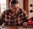 Older person and a child working on a craft together