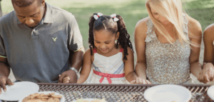 People dining at a picnic table