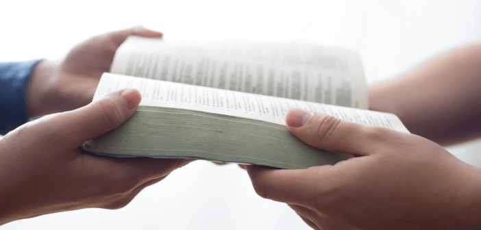 Passing a Bible from one person to another