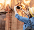 Happy person taking a photo of a church