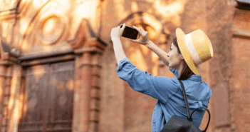 “Say Cheese!” Take Pictures to Expand Ministry Happy person taking a photo of a church