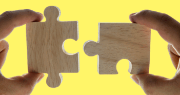 10 Ways Consolidation Can Strengthen Your Church’s Impact Closeup of two hands joining two puzzle pieces
