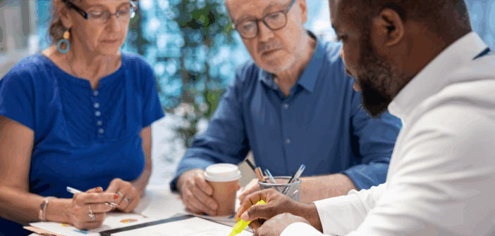 Finance team sitting at a table and reviewing financial figures
