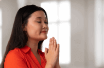 A person praying in a church sactuary