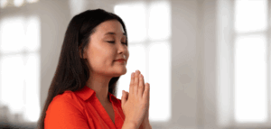 A person praying in a church sactuary