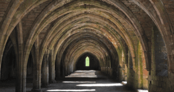 Congregational Vitality Begins with An Inward Journey View that looks far down the pathway through a series of old stone arches