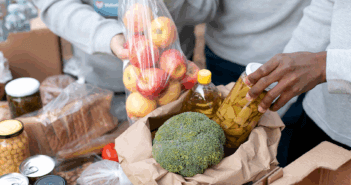 Close up volunteers collecting food donations