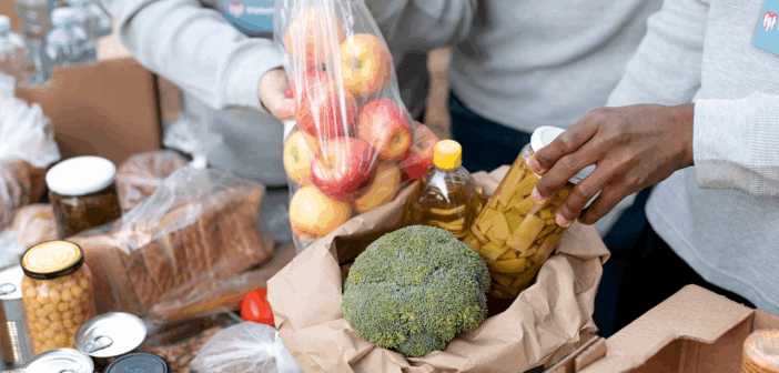 Close up volunteers collecting food donations