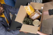 Sharing a box of groceries at a church food bank