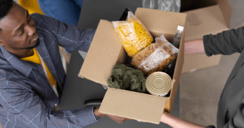 Sharing a box of groceries at a church food bank