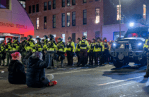 Photo of Minnesota Conservation Officers, Minnesota State Patrol, Hennepin County Sheriff and Minneapolis Police pushing out hundreds of protesters after declaring an unlawful assembly. This image was originally posted to Flickr by Chad Davis. at https://flickr.com/photos/146321178@N05/55033437170. It was reviewed on 17 January 2026 by FlickreviewR 2 and was confirmed to be licensed under the terms of the cc-by-4.0.