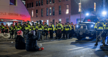 Photo of Minnesota Conservation Officers, Minnesota State Patrol, Hennepin County Sheriff and Minneapolis Police pushing out hundreds of protesters after declaring an unlawful assembly. This image was originally posted to Flickr by Chad Davis. at https://flickr.com/photos/146321178@N05/55033437170. It was reviewed on 17 January 2026 by FlickreviewR 2 and was confirmed to be licensed under the terms of the cc-by-4.0.