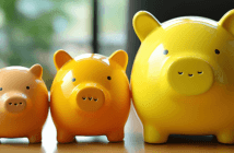 Three ceramic piggy banks getting progressively larger from left to right