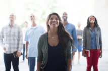Diverse group looking up toward God