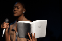 Female pastor holding the Bible
