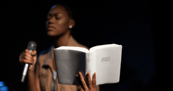 Female pastor holding the Bible