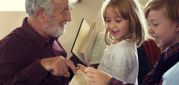 Pastor pointing out a passage in a children's Bible