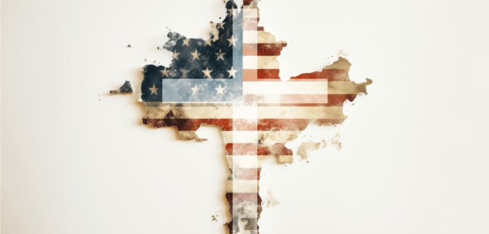 Christian cross in front of a tattered American flag