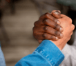 Two hands clenched in appreciation