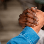 Two hands clenched in appreciation