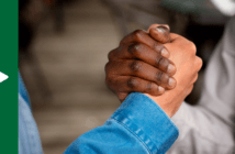 Two hands clenched in appreciation