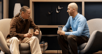 A pastor listening to a person during a conversation