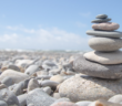 Carefully stacked stones on a rocky beach