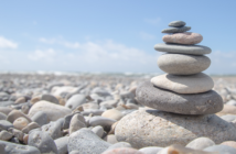 Carefully stacked stones on a rocky beach