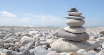 Carefully stacked stones on a rocky beach