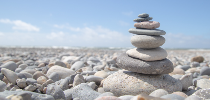 Carefully stacked stones on a rocky beach