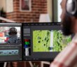 Videographer editing a video on the computer screen
