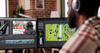 Videographer editing a video on the computer screen