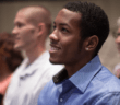 Smiling person sitting in a pew at a worship service